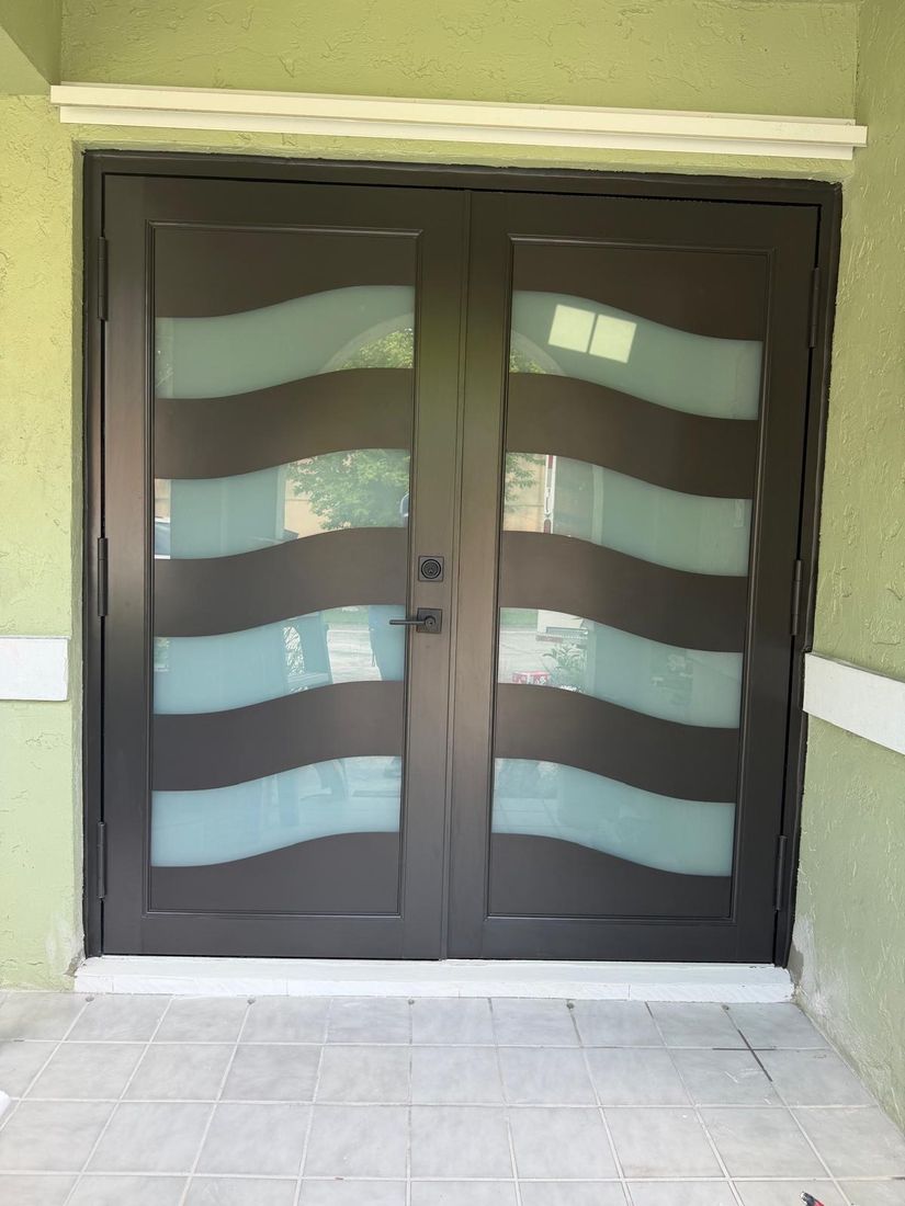 Double entry door with wavy frosted glass panels
