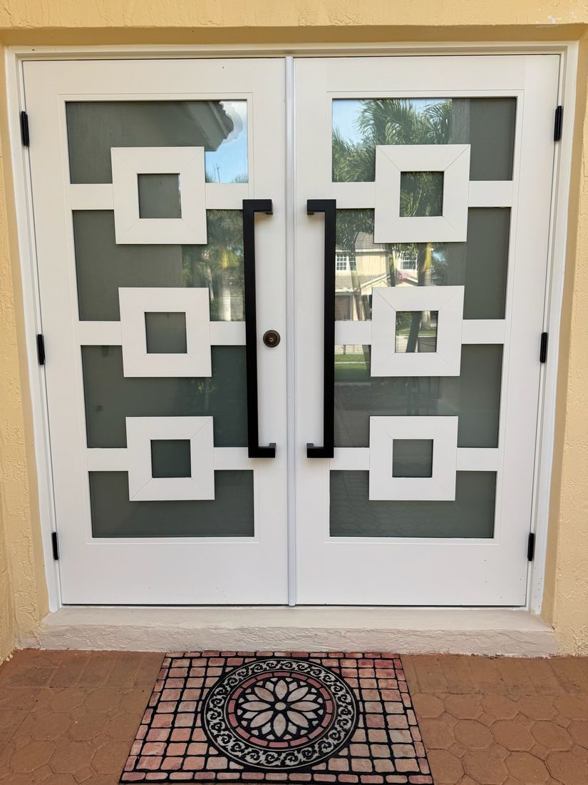 White double door with geometric glass panels