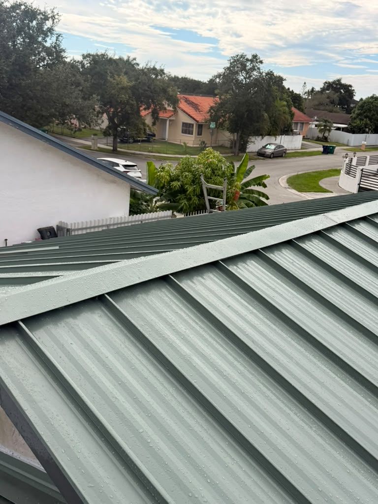 Green standing seam metal roof seen from above